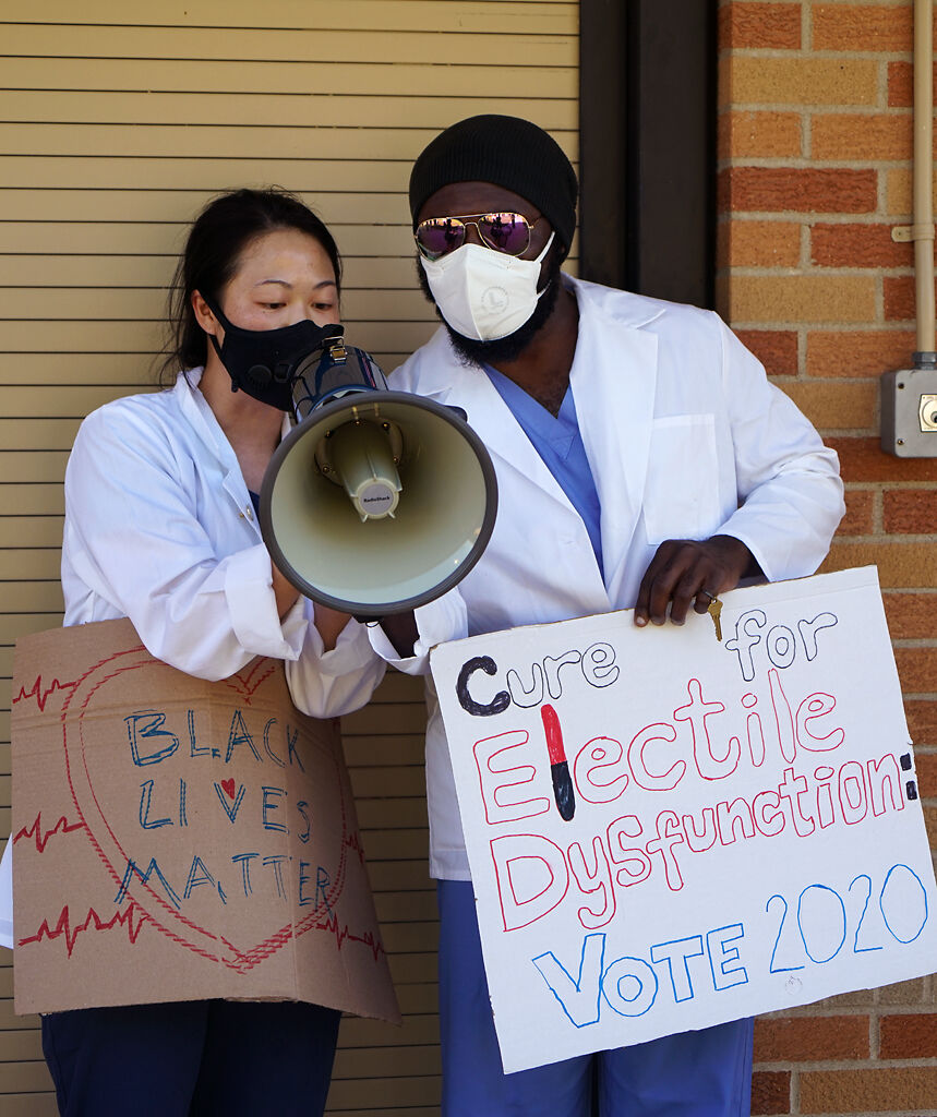 Two MU School of Medicine students speak to the crowd about the national conversation Thursday